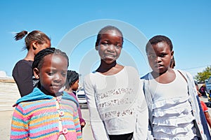 These children need your help. Cropped portrait of a group of kids at a community outreach event.