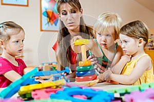 Children in nursery school learning and playing