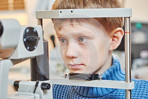 Children ophthalmology. Boy under optometrist test