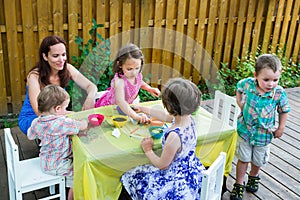 Children Outside Dyeing Easter Eggs