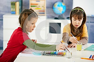 Children painting in art class