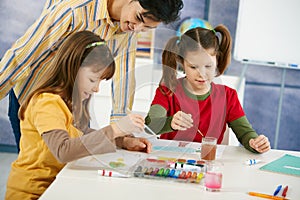 Children painting in art class
