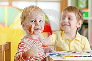 Children painting at home or playschool photo