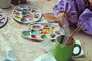 Children painting pottery 10