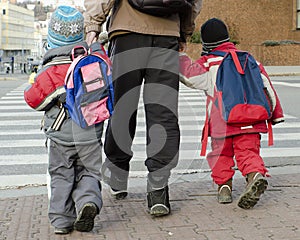 Children a parent crossing road