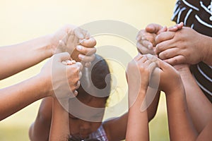 Children and parent holding hands and playing together