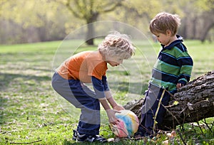Children in park with colourful ball