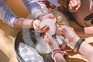 Children participate in a chemical experiment. Foam from a flask and children's hands