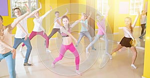 Children participating in dance class with teacher