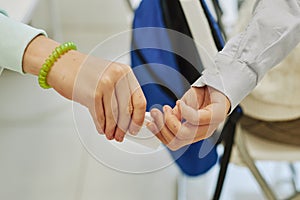 Children Passing Note in Class Closeup