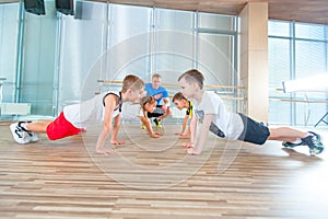 Children at physical education lesson in school gym gymnast kid