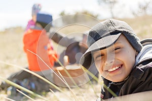 Children picnic happy smile outdoor close up lying on the grass