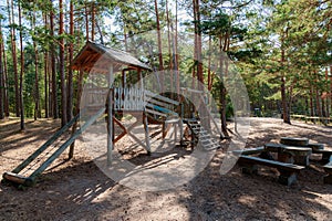 Children play area in pine tree park near Saulkrasti town, Latvia.