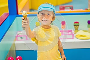 Children play as ice cream seller.