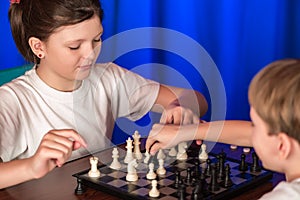 Children play a board game called chess.