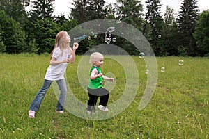 Children play with bubbles