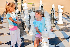 Children play chess outdoor