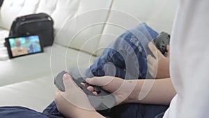 Children play console in gamepads teamwork. kids a boy and a girl are playing a portable set-top box in a lifestyle TV