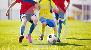 Children play football. Soccer football game for youth