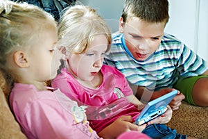 Children play on game console