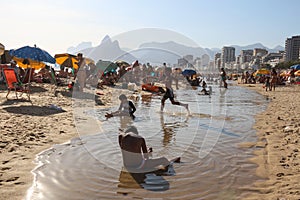 Children play on Ipanema beach