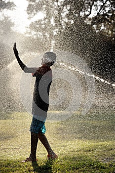 Children play with jets of water