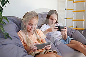 Children play with a mobile phone at home