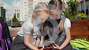 Children Play With Mobile Phone In Schoolyard