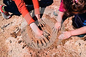 Children play mud outside without worrying about hygiene and microbes