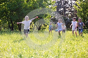 Children play outdoors running and having fun