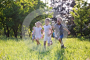 Children play outdoors running and having fun