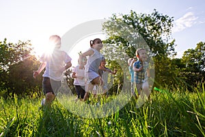 Children play outdoors running and having fun