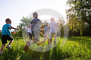 Children play outdoors running and having fun