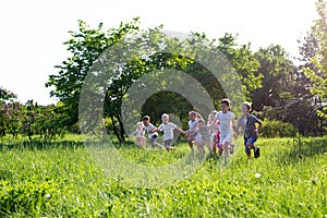 Children play outdoors running and having fun