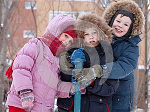 Children play on the playground. Winter day