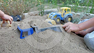 Children play in the sand toys. toys for child sandboxes against the beach kids sand background. summer holidays