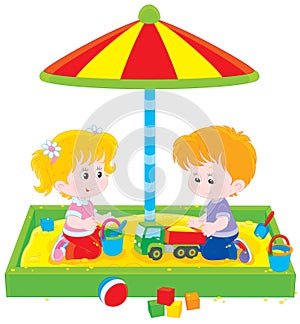 Children play in a sandbox