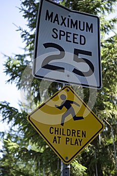 Children at play sign with speed limit.