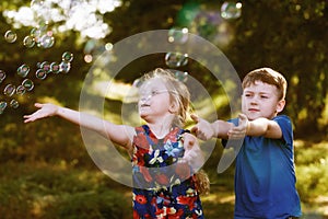 Children play with soap bubbles in the Park