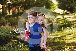 Children play with soap bubbles in the Park