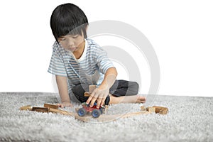 Children play with a toy designer on the floor of the children`s room. Kids playing with colorful blocks. Kindergarten educational