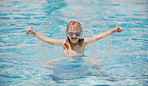 Children play in tropical resort. Family beach vacation. Child in summer swimming pool. Kids learn to swim.