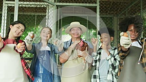 Children play uncle farmer`s hen in agriculture and livestock education.