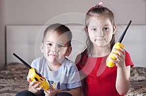 Children play with walkie-talkie