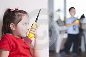 Children play with walkie-talkie