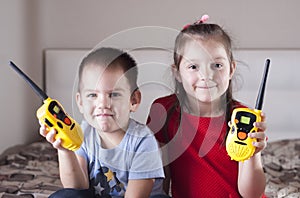 Children play with walkie-talkie