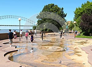 Children Play in the Water at the River Park on Mud Island