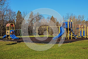 Children playground activities in public park without children . Colorful Safe modern children`s playground.