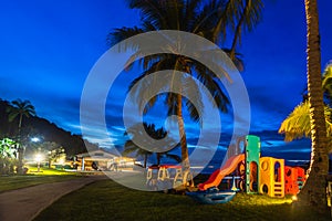 Children playground on the beach at twilight time at Koh Chang island, thailand