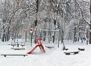 Children playground equipment park in winter